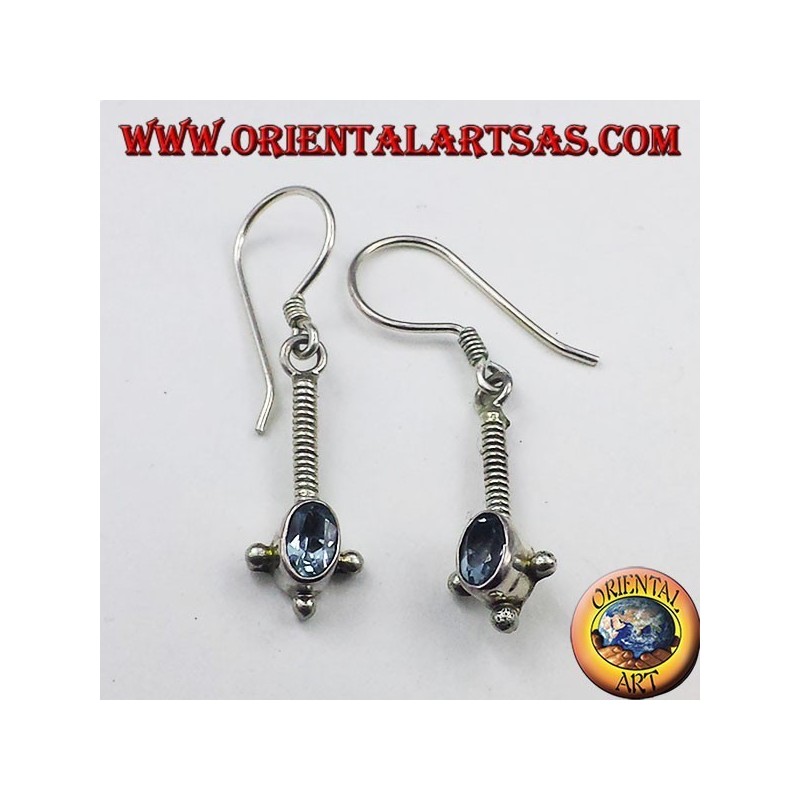 Silver earrings with oval faceted blue topaz