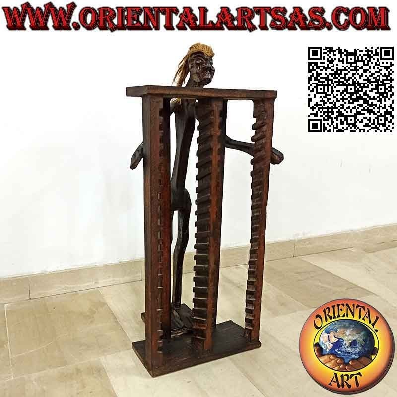 CD holder in primitive style with sculpture of an aboriginal in teak wood (80 cm)