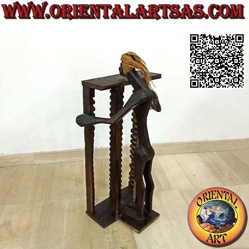 Porte-CD de style primitif avec sculpture d'un aborigène en bois de teck (80 cm)