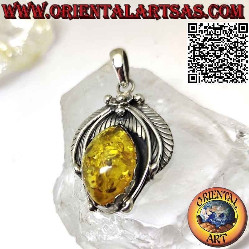 Silver pendant with large cabochon shuttle amber with crown of leaves and central flower