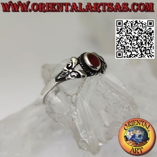 Silver ring with oval carnelian and decorated with two leaves on both sides