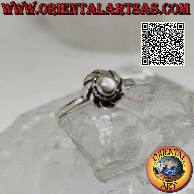 Silver ring with small round mother of pearl in the center of a vortex