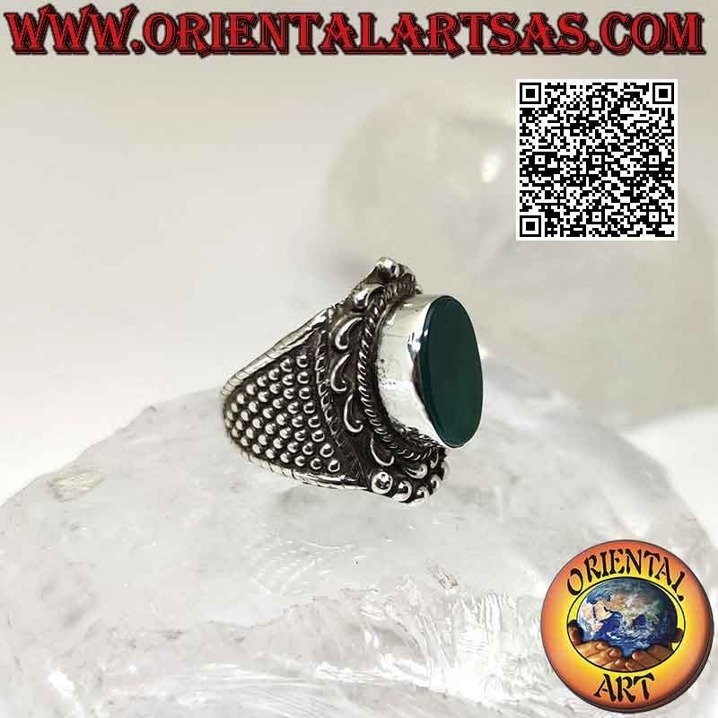Wide band silver ring with large oval green agate with baroque crown and balls around