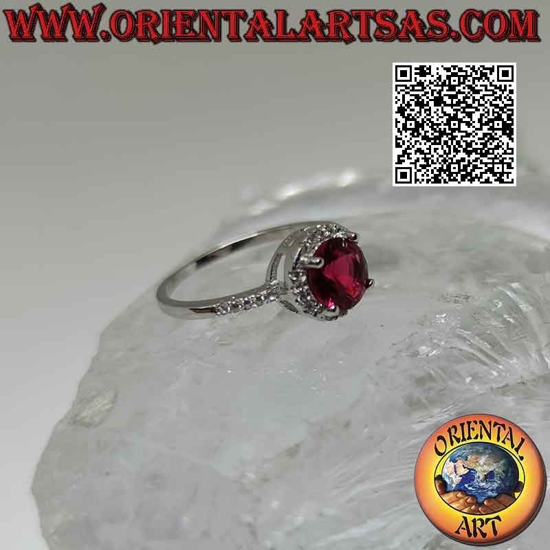 Bague en argent avec rubis synthétique rond serti entouré de zircons et extension sur les côtés