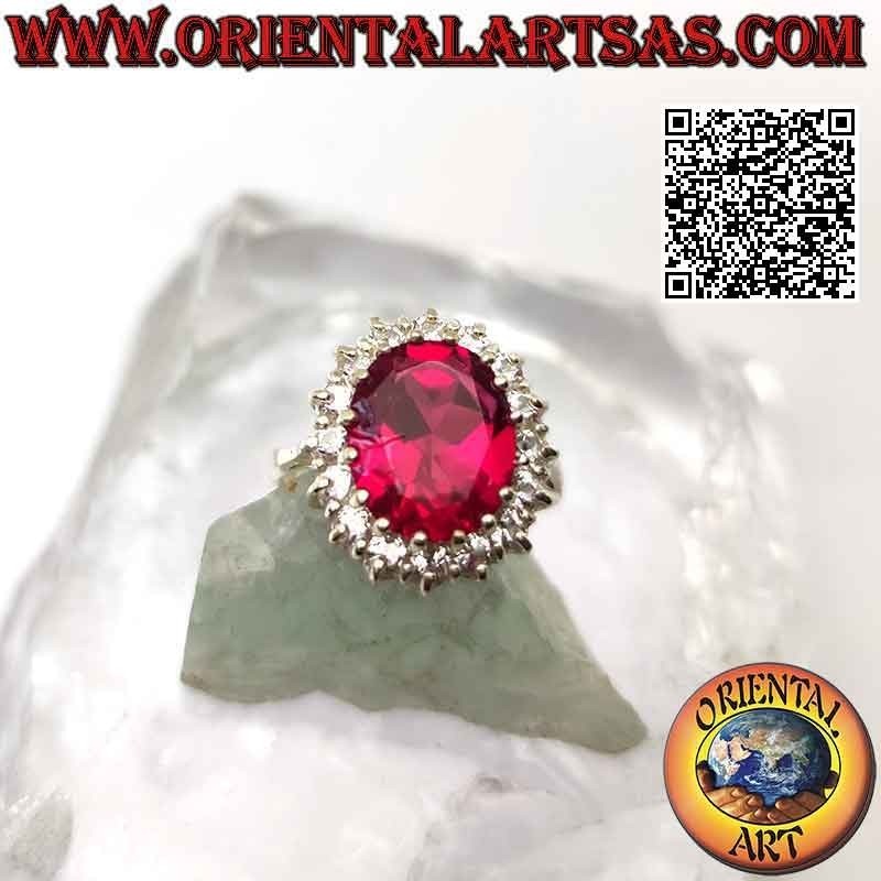 Anello in argento con grande rubino sintetico ovale incastonato contornato da zirconi bianchi tondi