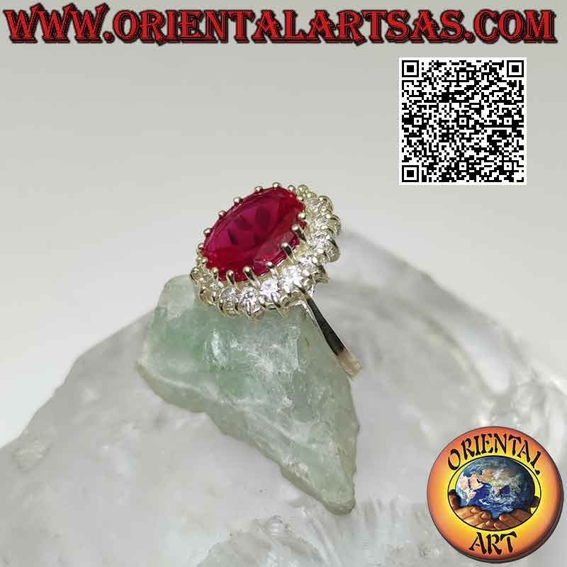 Bague en argent avec gros rubis synthétique ovale serti entouré de zircons blancs ronds