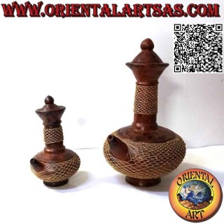 Traditional Lombok magic pitcher in terracotta and woven wicker wire, handmade