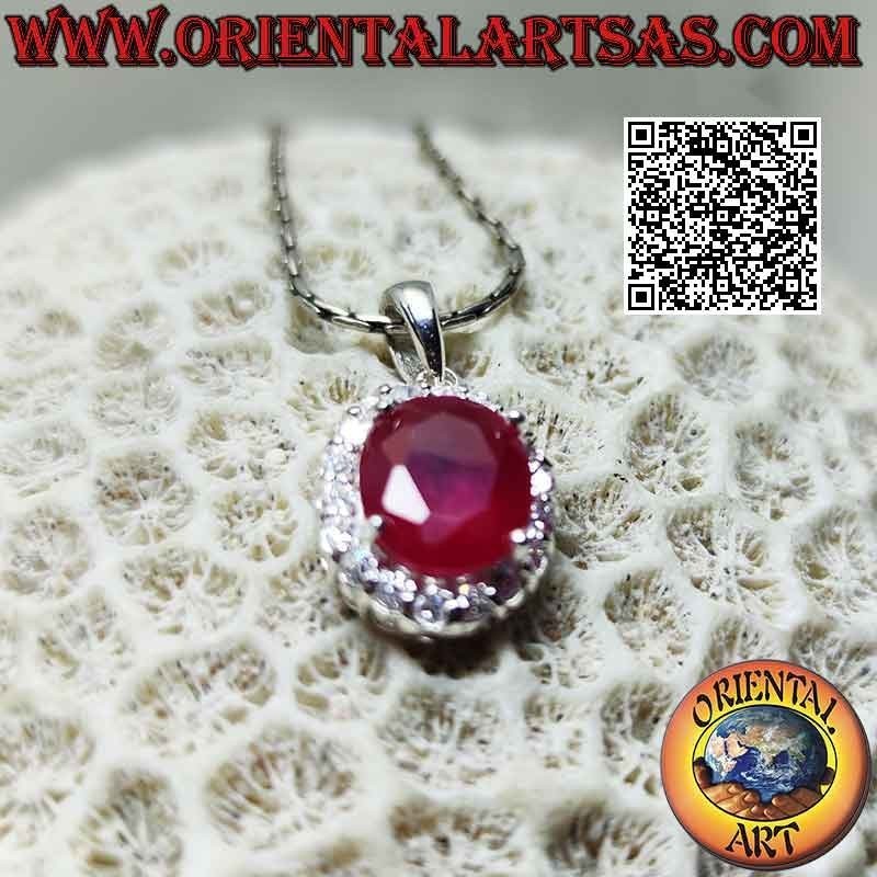 Silver pendant with large oval synthetic ruby set surrounded by set round zircons
