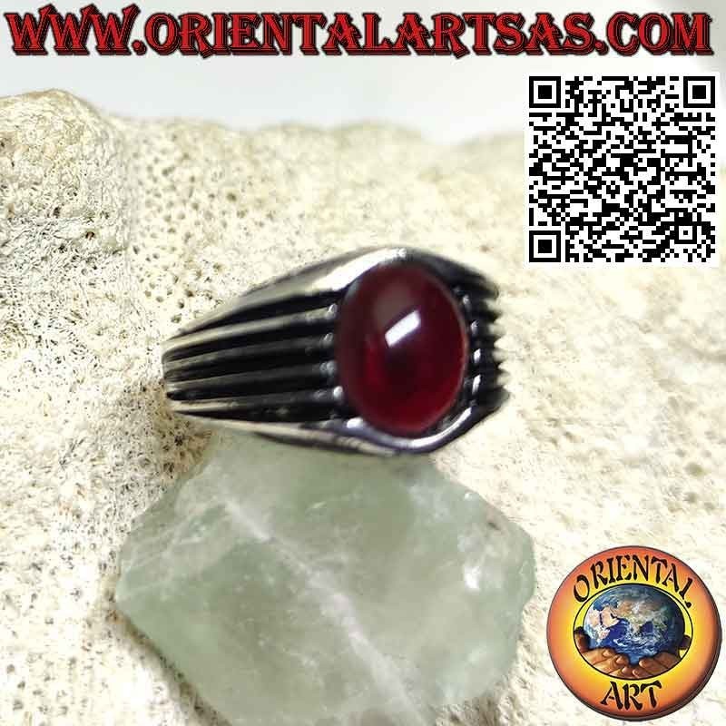 Silver ring with oval cabochon garnet and parallel lines engraved on the sides
