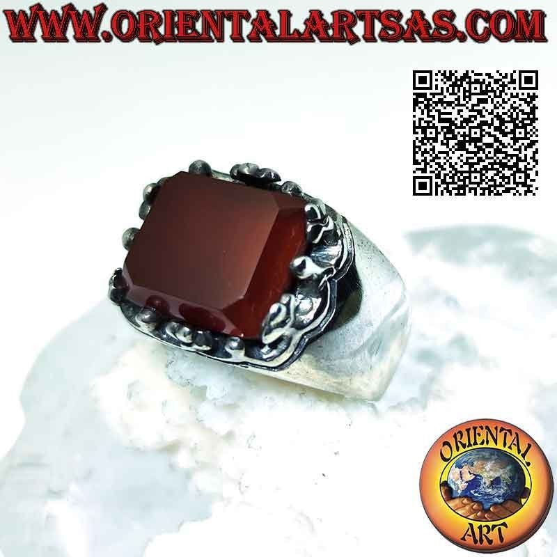 Silver ring with raised rectangular carnelian framed by balls and crosses