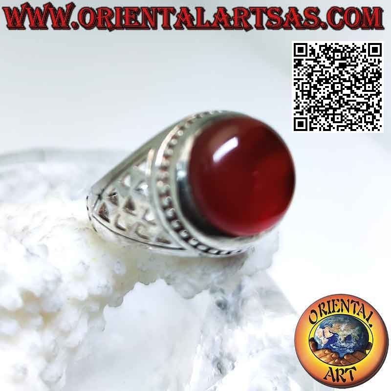 Silver ring with round cabochon carnelian and a series of triangular openwork on the sides
