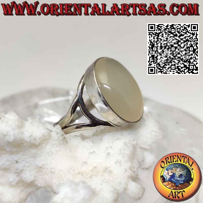 Silver ring with oval cabochon moonstone on a smooth setting of sinuous lines