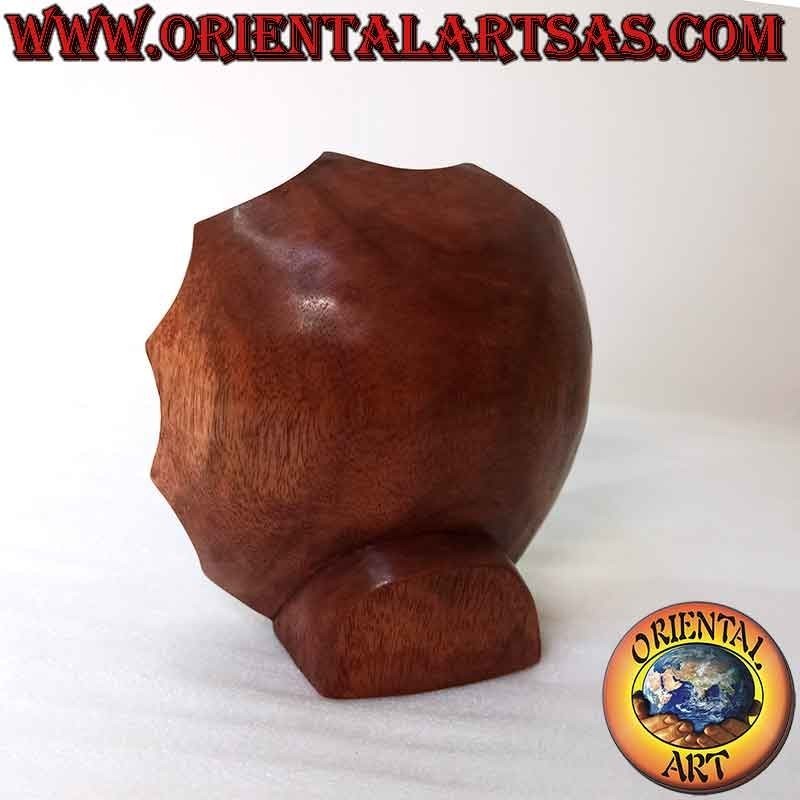 Face sculpture of the buddha of abundance carved out of suar wood