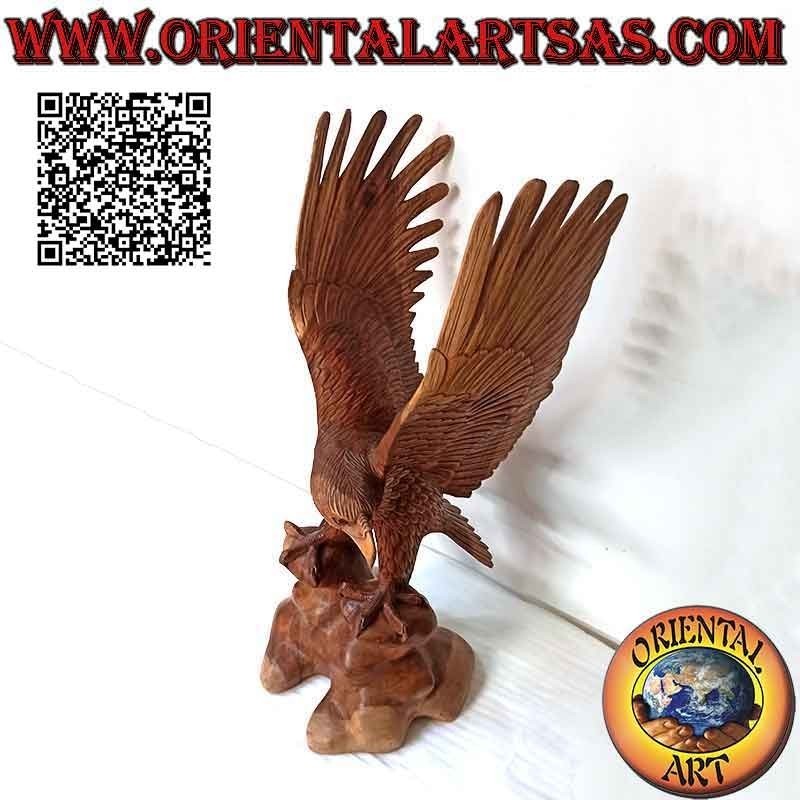 Golden eagle sculpture with spread wings standing on the 80 cm suar wood promontory