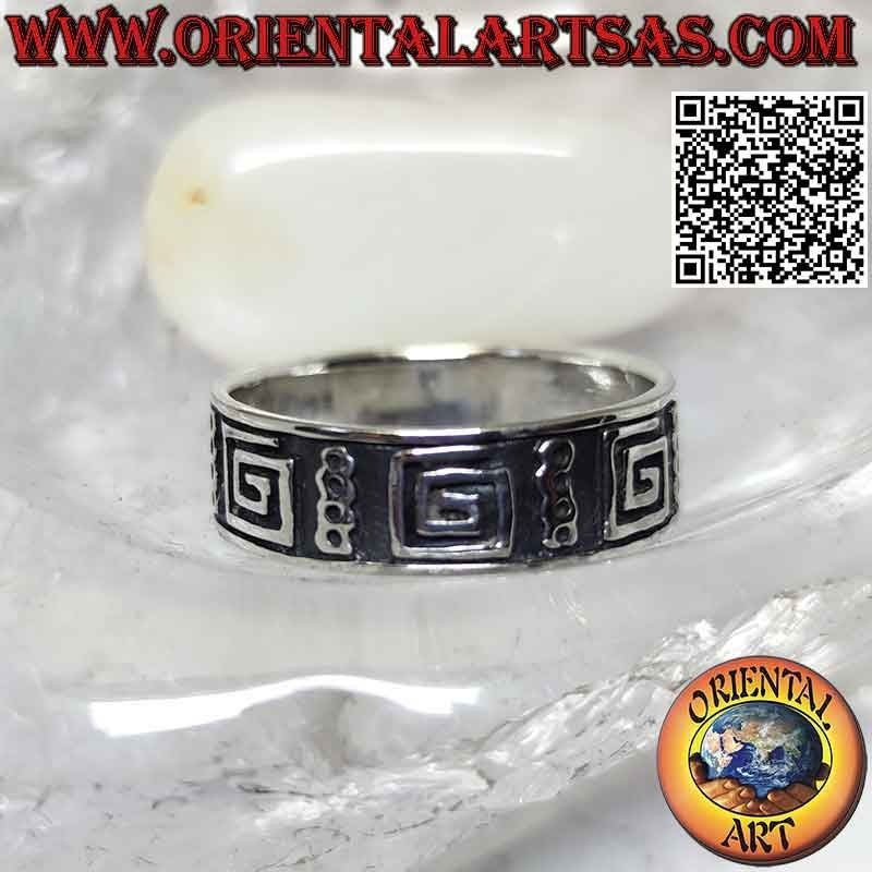 Silver band ring worked with a series of smooth squared spirals in bas-relief