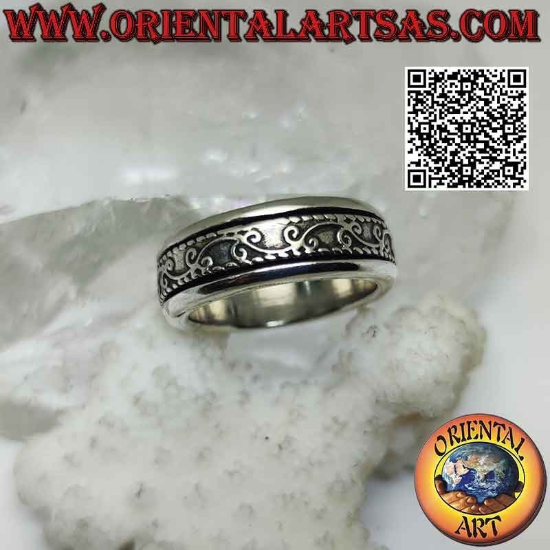 Silver ring with antistress band, ivy twig in sinuous movement in bas-relief