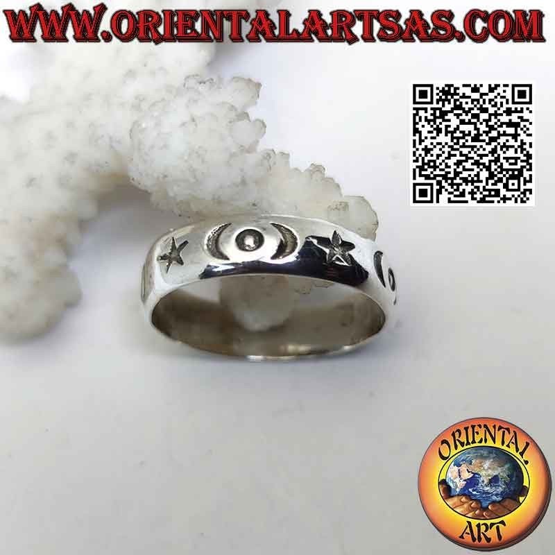 Silver band ring with stars, crescents and engraved circles