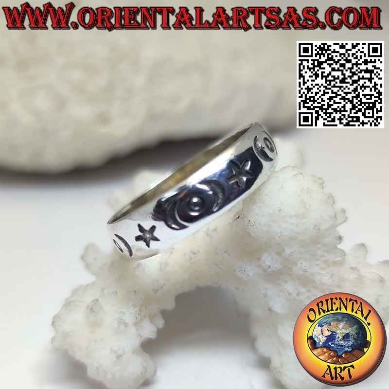 Silver band ring with stars, crescents and engraved circles