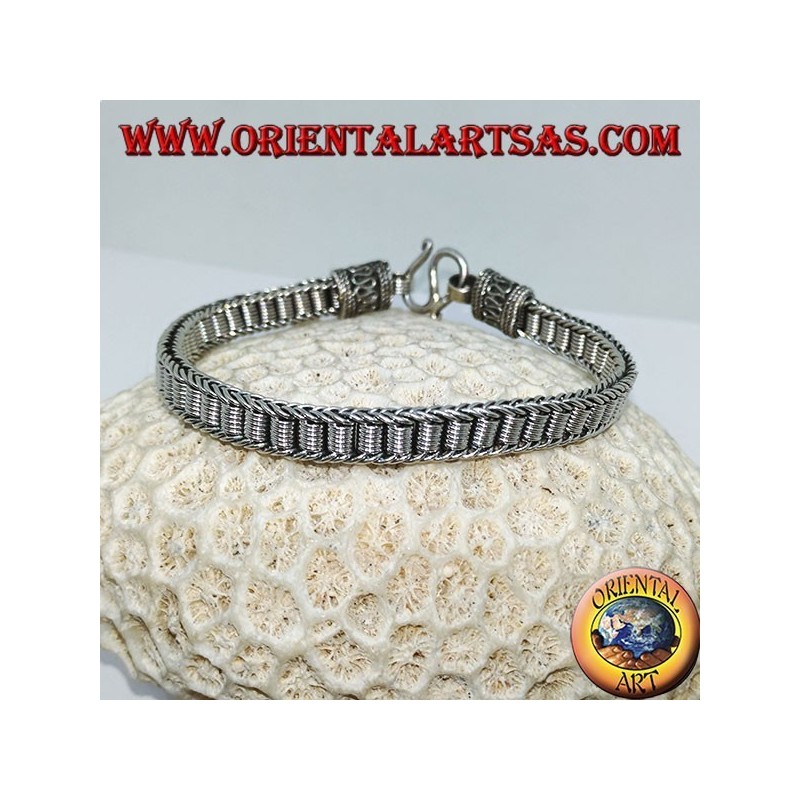 Flat silver bracelet with central spirals