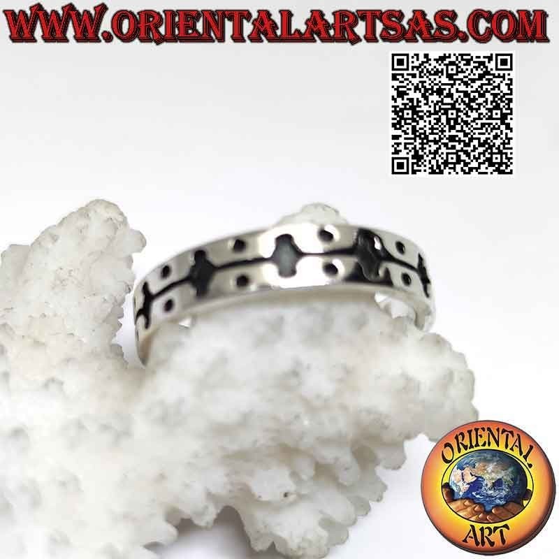 Silver ring with a worked band with an engraved decoration of rhombuses joined by a line and balls on the four corners