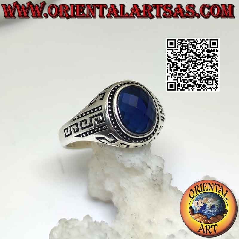 Silver ring with faceted oval synthetic sapphire and engraved Greek on the sides