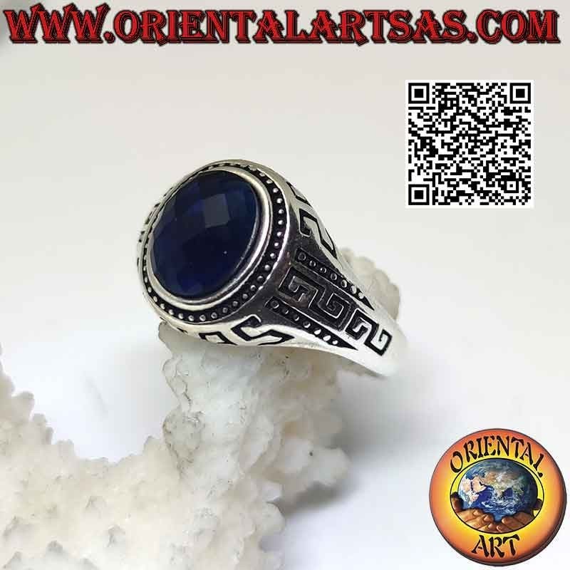 Silver ring with faceted oval synthetic sapphire and engraved Greek on the sides