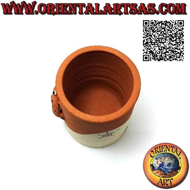 Hand made cylindrical pen holder with frog and spirals in terracotta