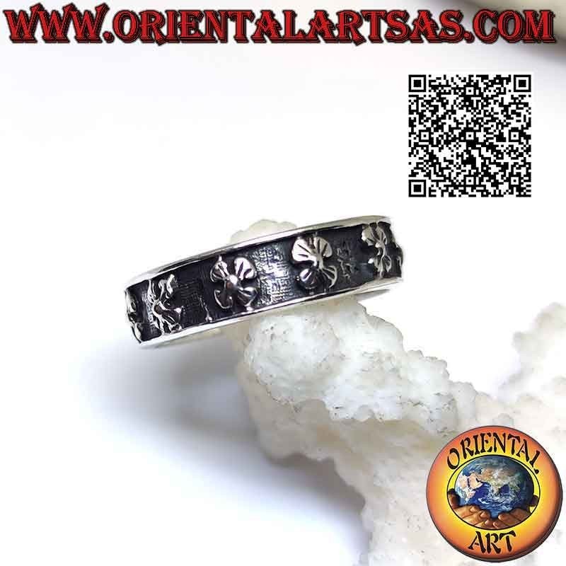 Silver band ring worked with four-petal flowers (lunaria odorosa or woodruff) in bas-relief