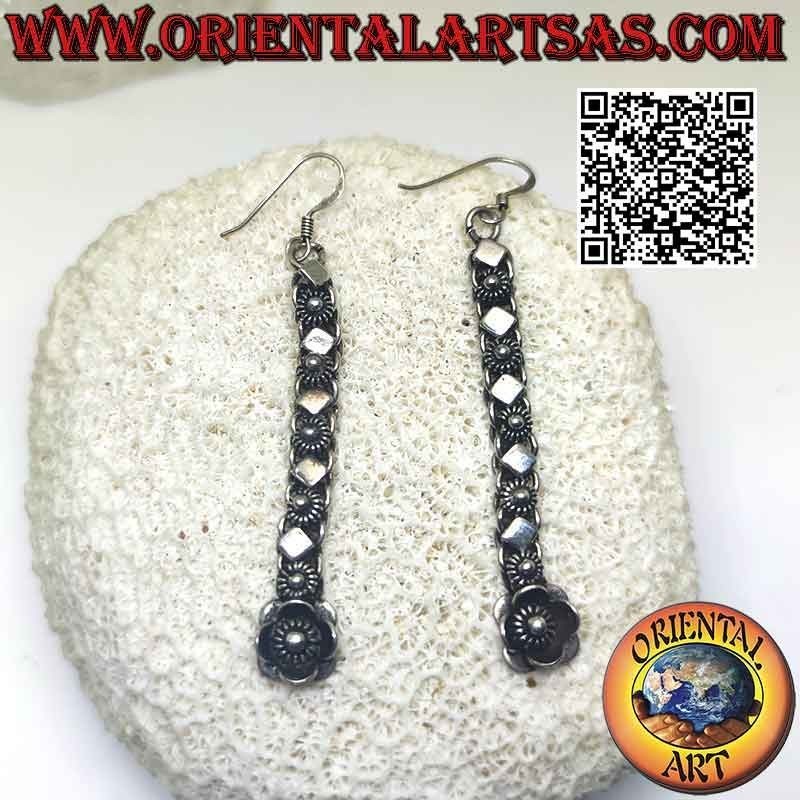Silver earrings with a row of flowers and alternating rhomboid plates (pendants)