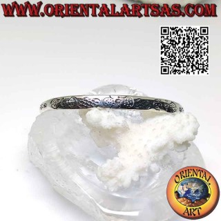 Pulsera rígida en plata 925‰ con decoración maorí simétrica grabada y bola terminal