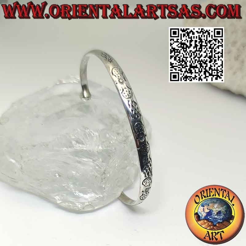 Pulsera rígida en plata 925‰ con decoración maorí simétrica grabada y bola terminal