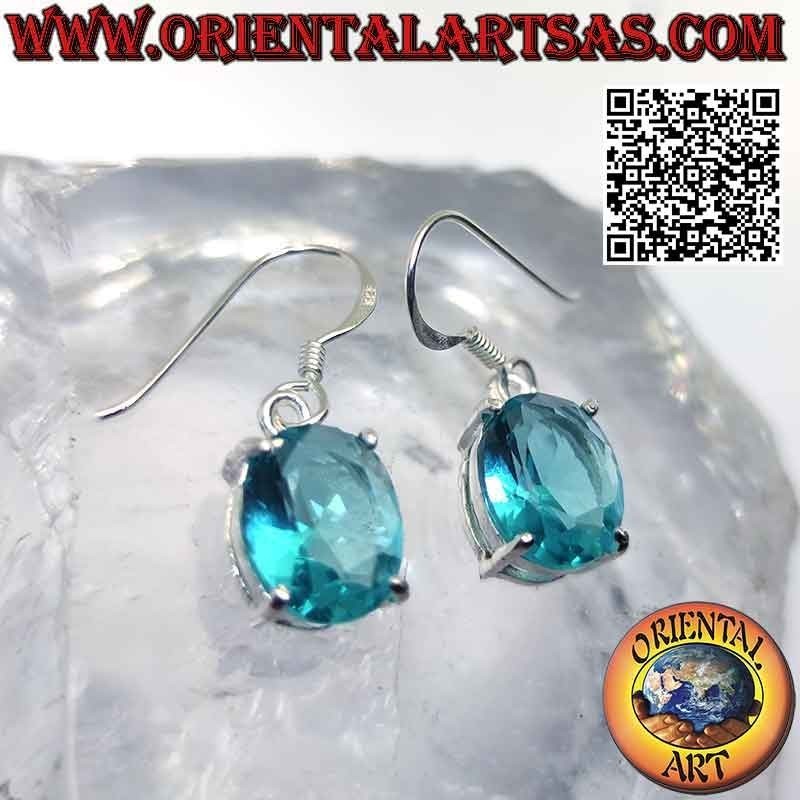 Silver earrings with oval faceted topaz set in a smooth double frame