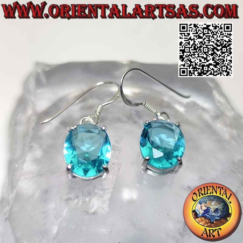 Silver earrings with oval faceted topaz set in a smooth double frame
