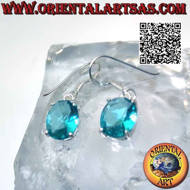 Silver earrings with oval faceted topaz set in a smooth double frame