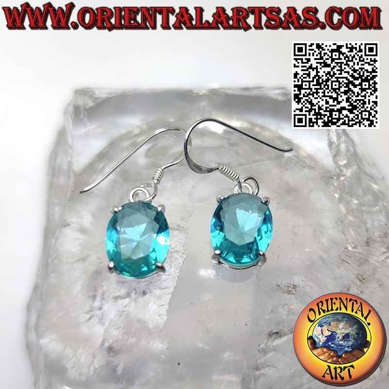 Silver earrings with oval faceted topaz set in a smooth double frame