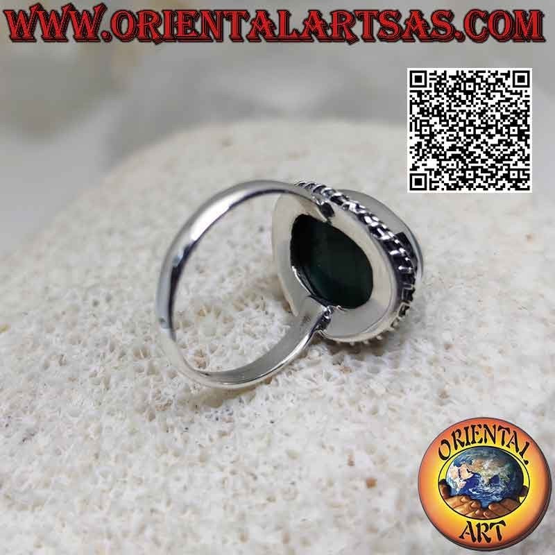 Silver ring with cabochon oval malachite (horizontal streaks) surrounded by interweaving and helical line