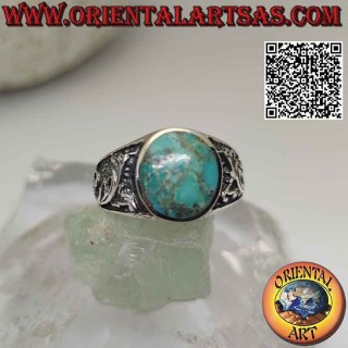 Silver ring with natural oval Arizona turquoise and floral decoration on the sides