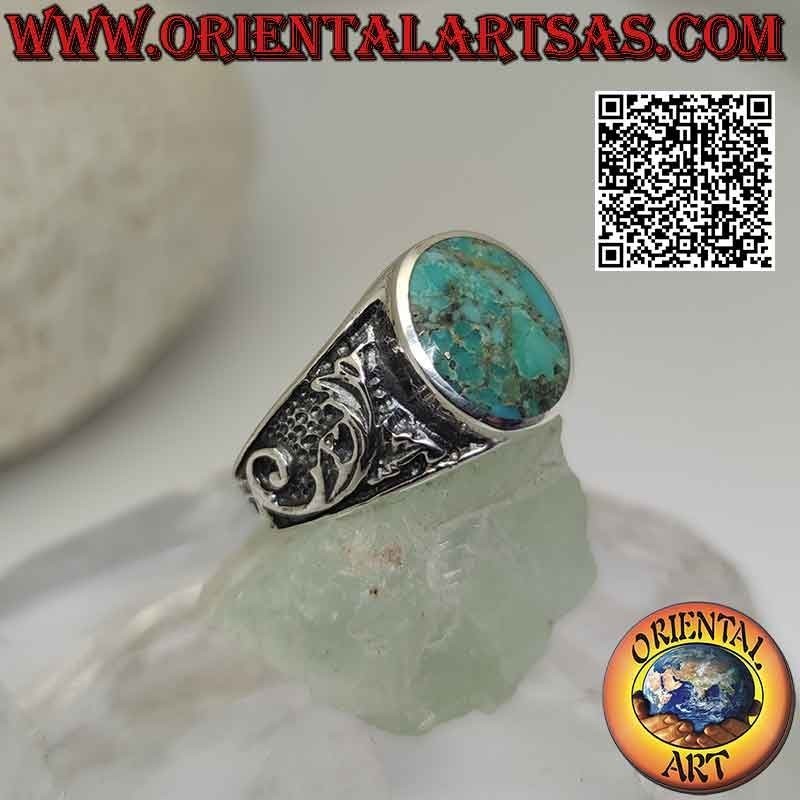 Silver ring with natural oval Arizona turquoise and floral decoration on the sides
