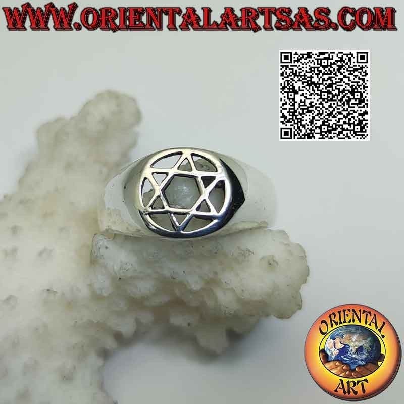Silver ring with star of David (6-pointed star) in the perforated circle on a smooth setting