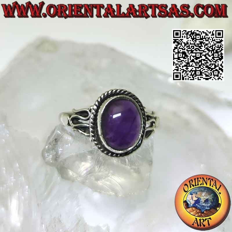 Silver ring with oval cabochon amethyst and serpentine on the sides