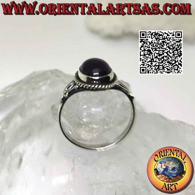 Silver ring with oval cabochon amethyst and serpentine on the sides