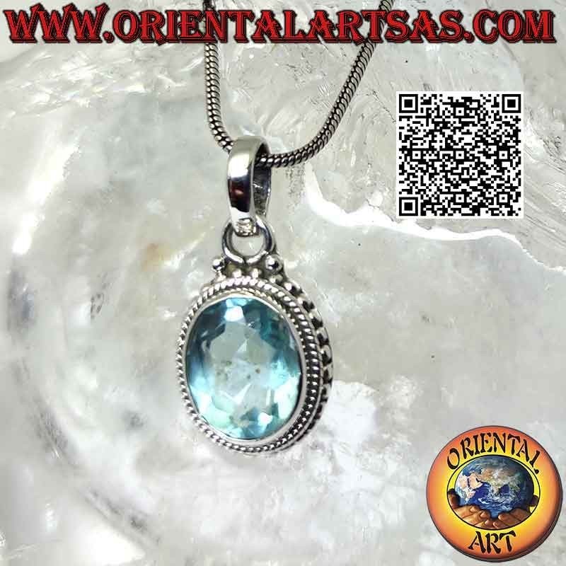 Colgante de plata con topacio azul ovalado y entrelazado y bolitas