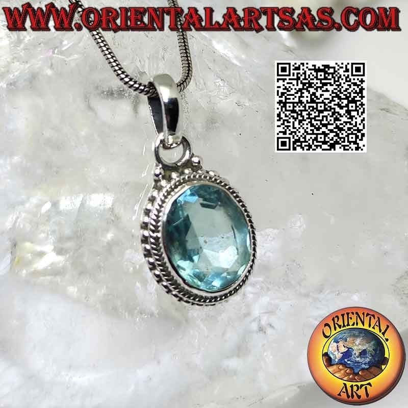 Colgante de plata con topacio azul ovalado y entrelazado y bolitas