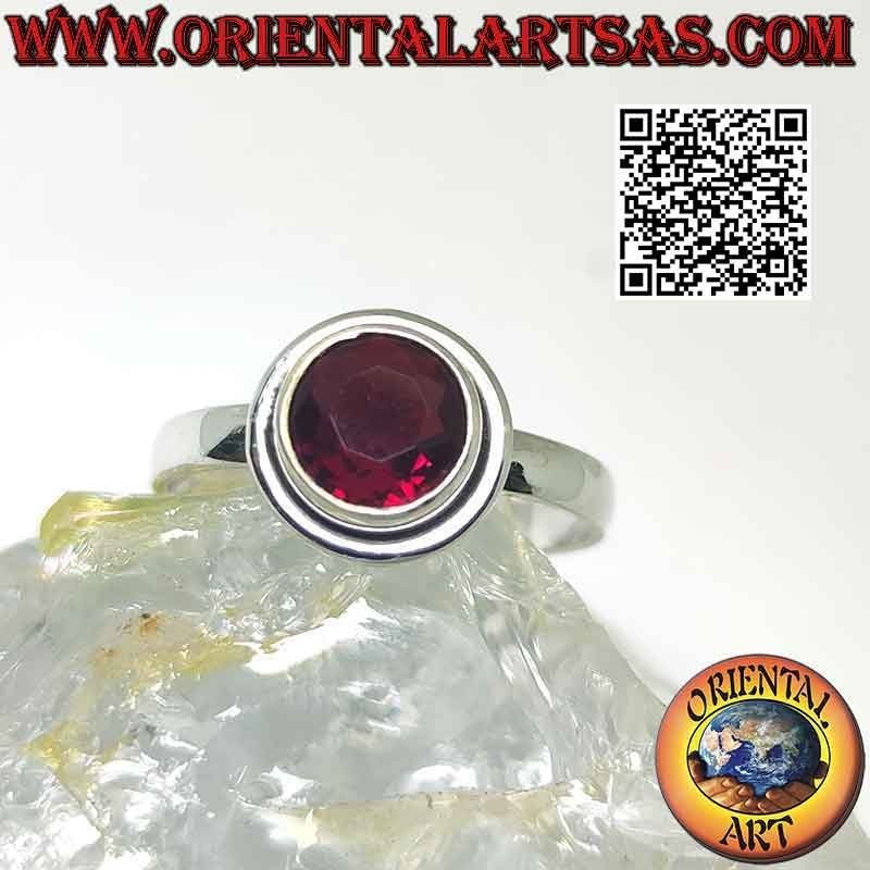 Silver ring with raised faceted round garnet