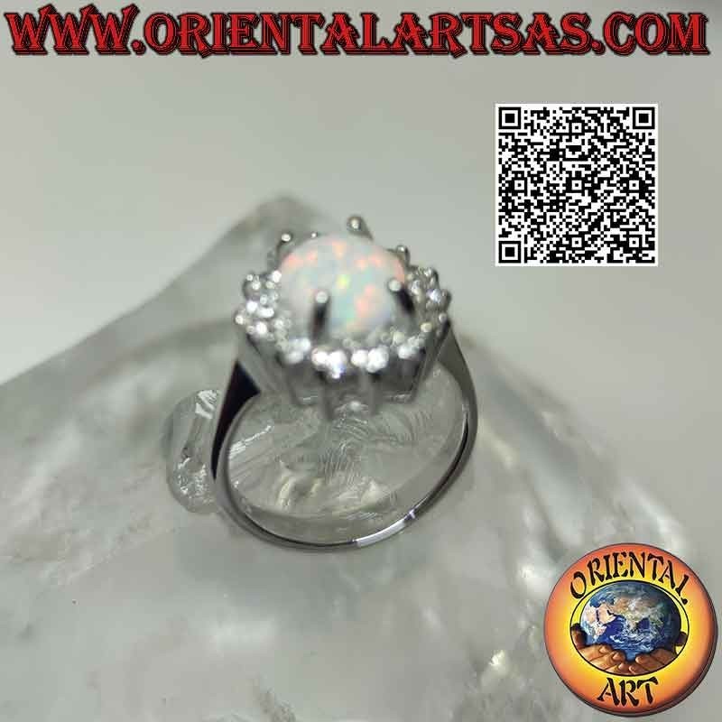 Silver ring with oval harlequin opal surrounded by zircons