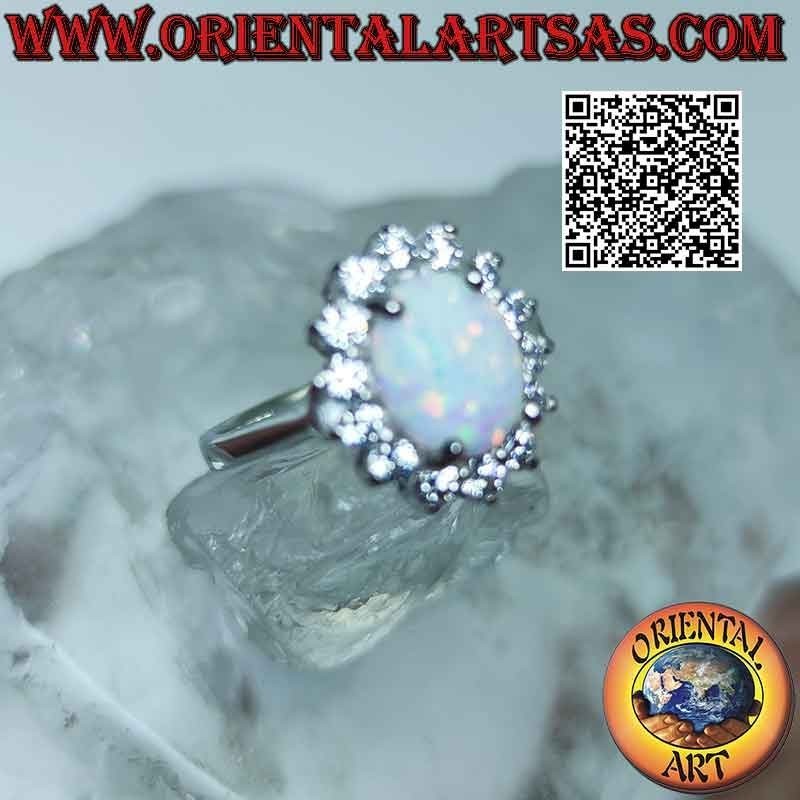 Silver ring with oval harlequin opal surrounded by zircons