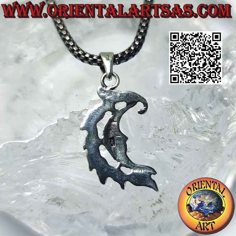 Silver pendant, smooth crescent with face and crest of leaves