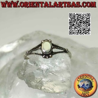 Silver ring with small oval mother-of-pearl between trio of balls and triple hook on the sides