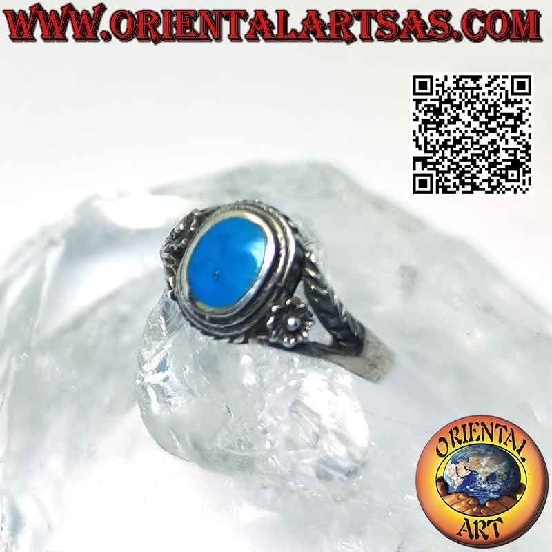 Silver ring with oval turquoise and asymmetrical flower and branch
