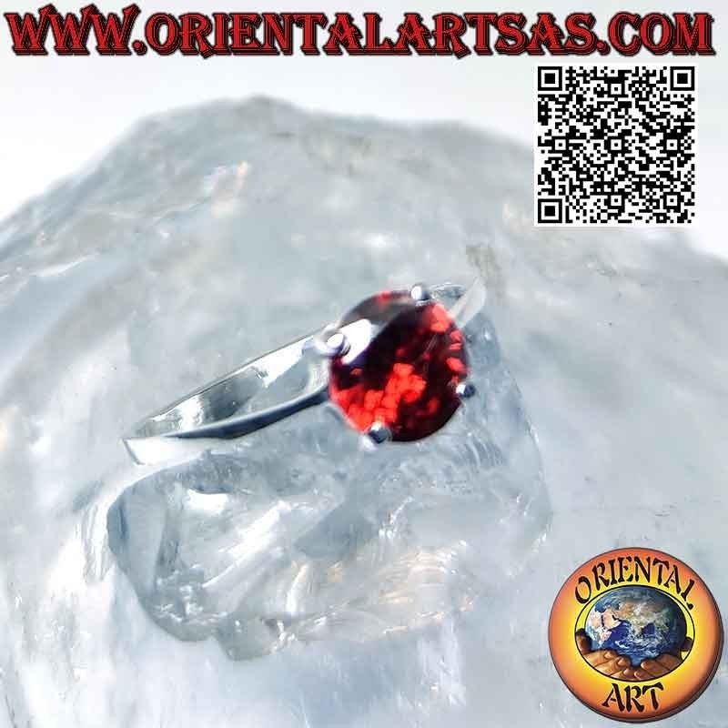 Silver ring with round garnet set on a smooth setting